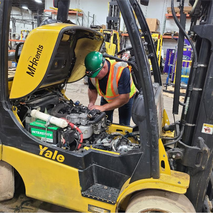 Technician fixing engine