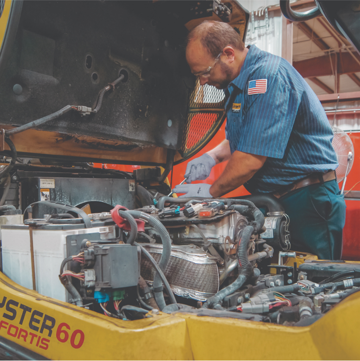 Technician fixing a huge engine